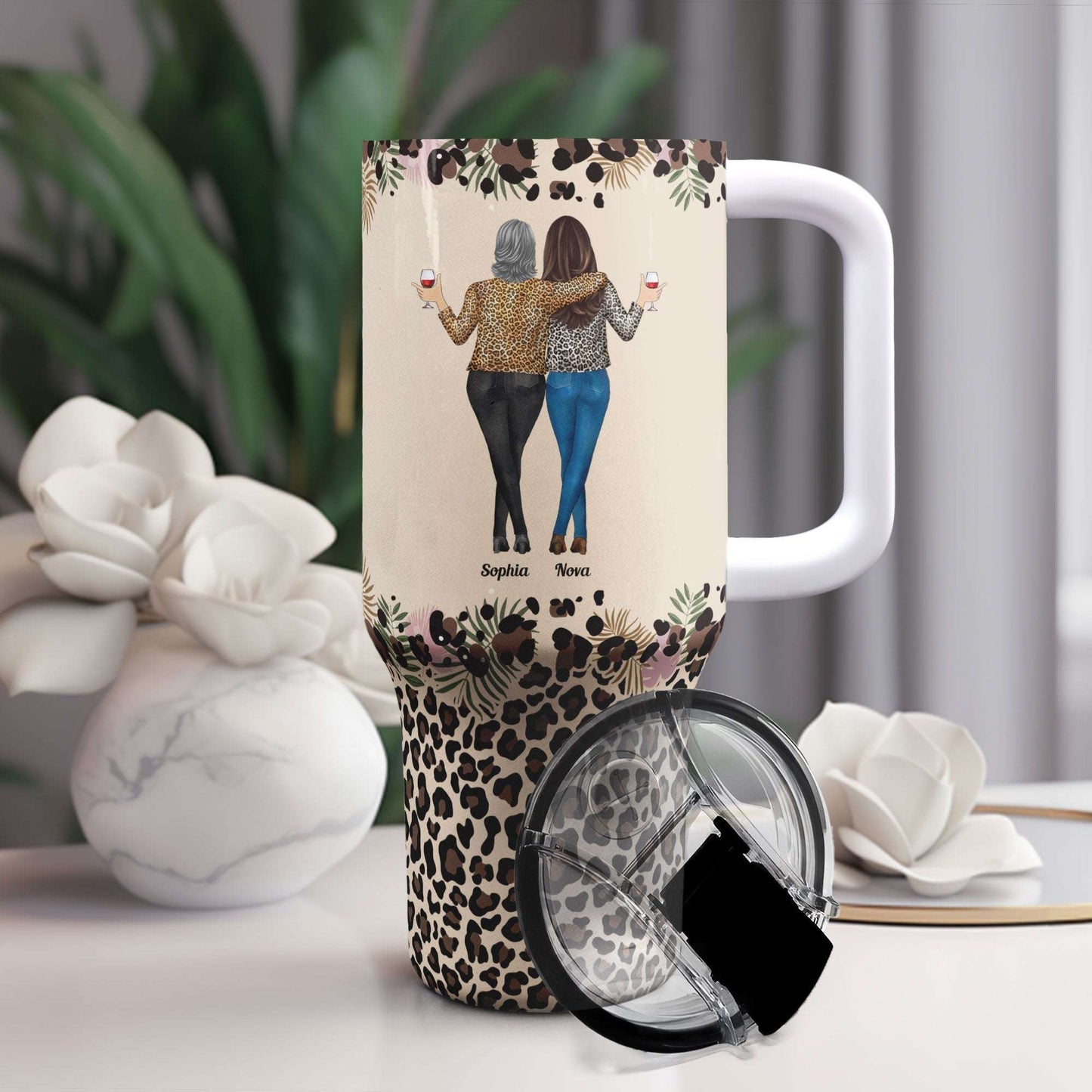 Personalized 40oz tumbler with straw, featuring "To My Badass Daughter" design and leopard print base, perfect gift.
